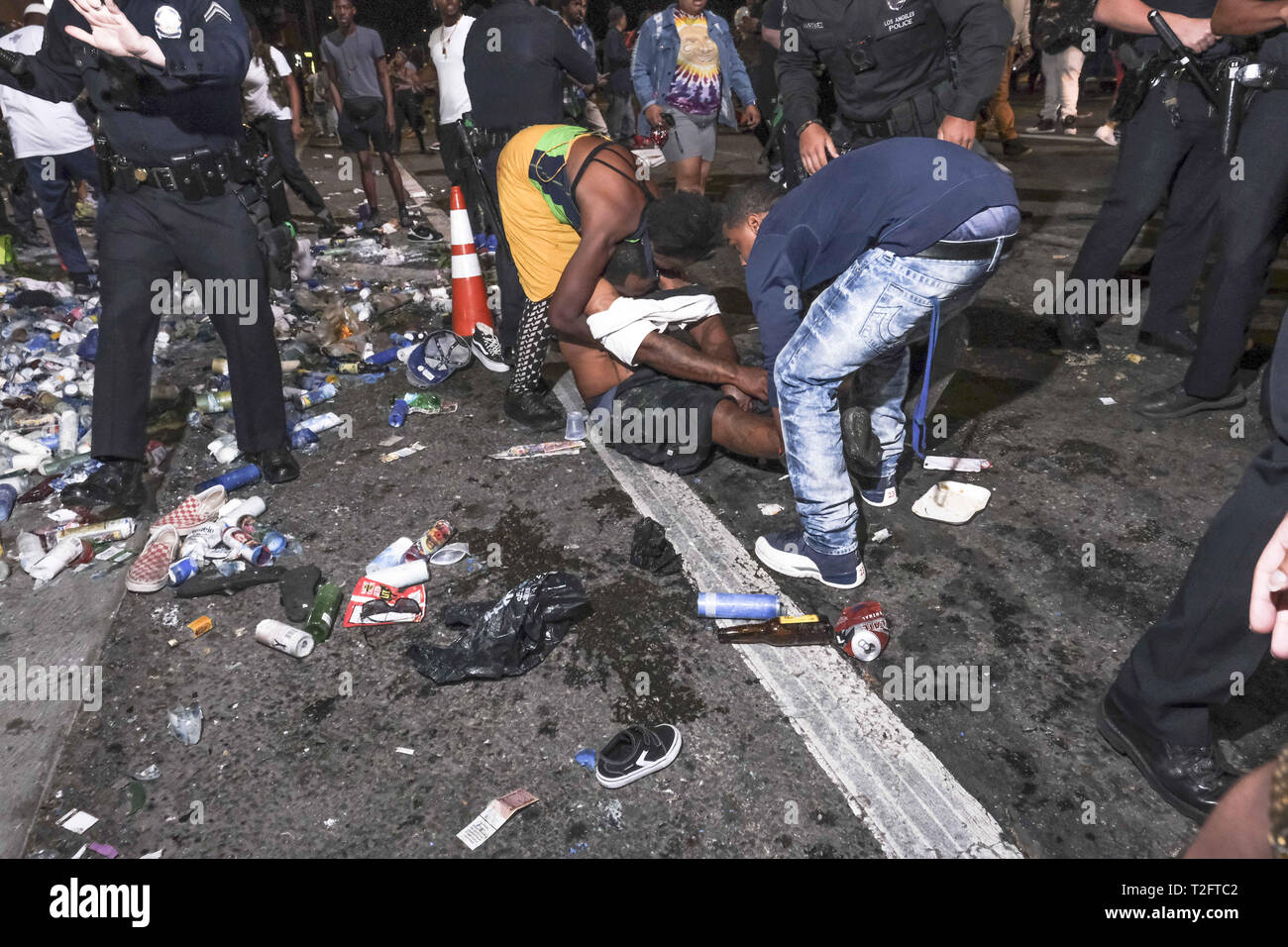 April 1, 2019 - Fans and mourners take photos as they gather at a growing memorial in front of the Marathon Clothing store where rapper Nipsey Hussle was killed. (Credit Image: © Jason RyanZUMA Wire) Stock Photo