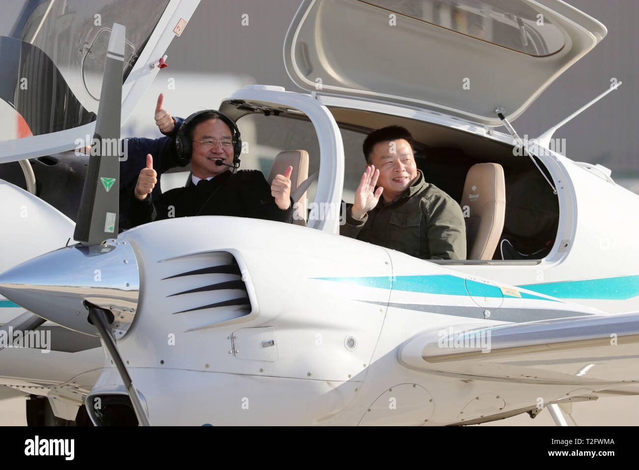 Chicago, USA. 2nd Apr, 2019. Zhang Bo (L, Front) and his co-pilot ...