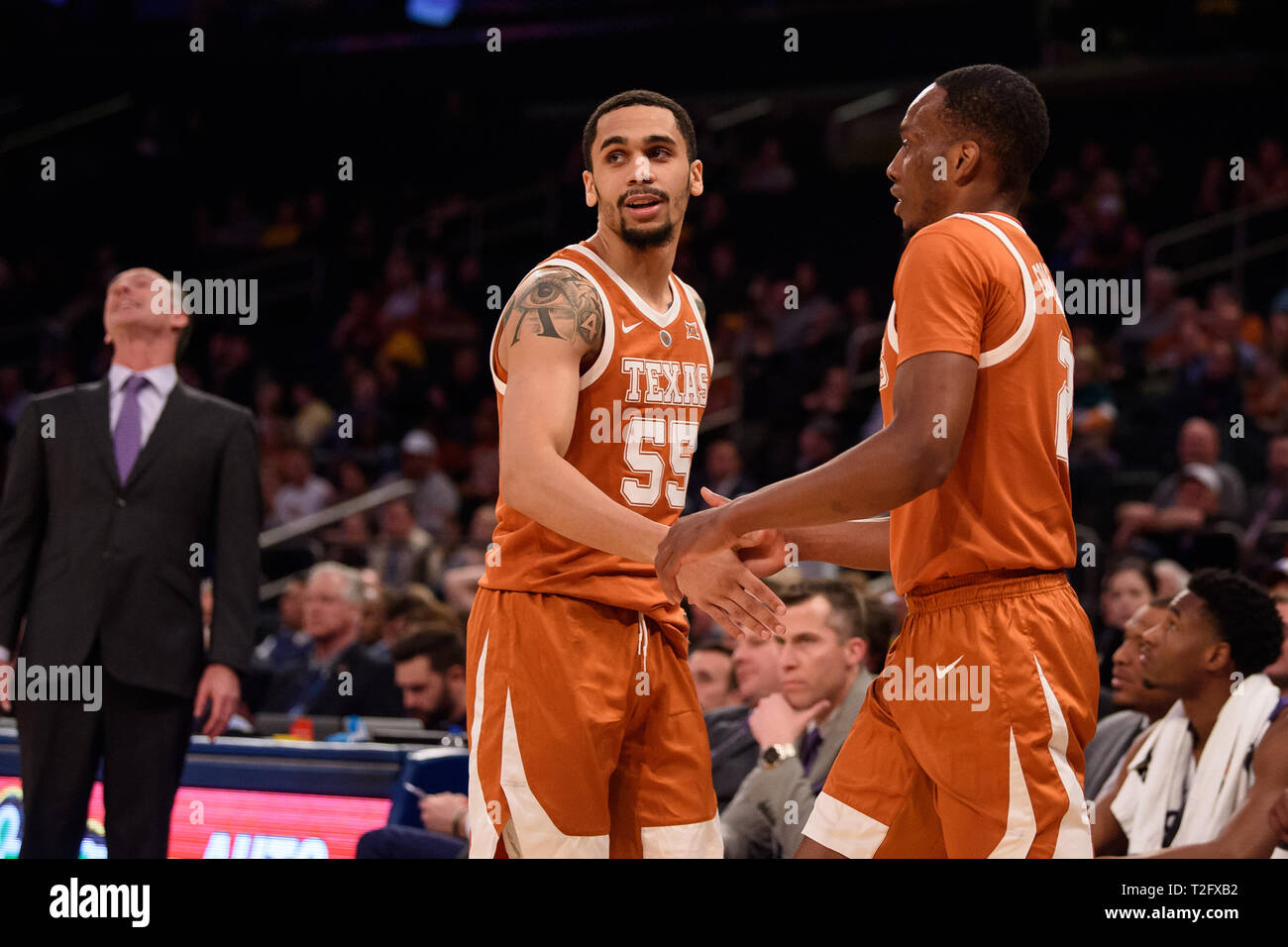 April 02, 2019: Texas Longhorns guard Elijah Mitrou-Long (55) and Texas Longhorns guard Matt Coleman III (2) react after the play as TCU Horned Frogs head coach Jamie Dixon is frustrated at the semi-final of the NIT Tournament game between The Texas Longhorns and The TCU Horned Frogs at Madison Square Garden, New York, New York. Mandatory credit: Kostas Lymperopoulos/CSM Stock Photo