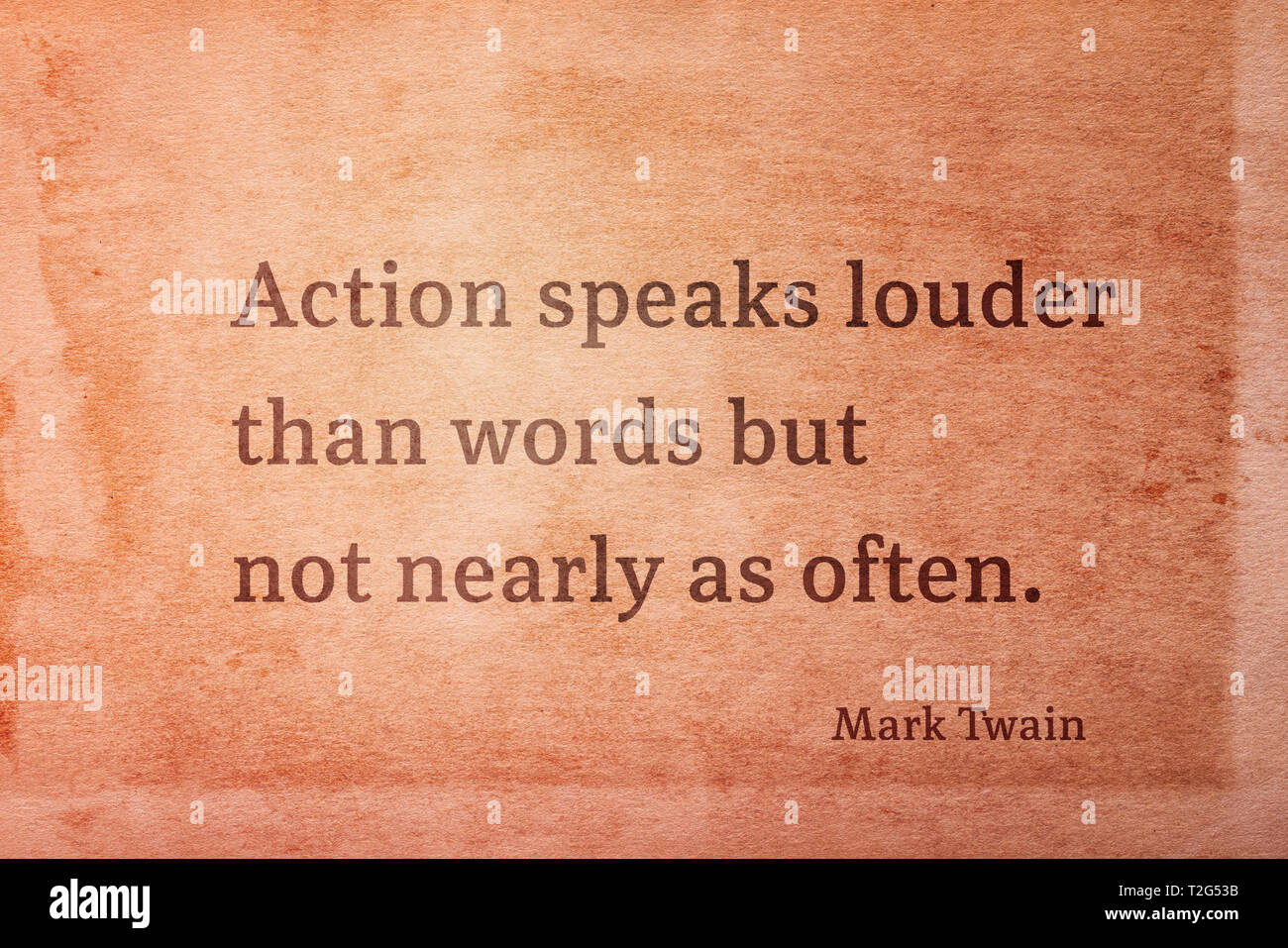 Action speaks louder than words but not nearly as often - famous American writer Mark Twain quote printed on vintage grunge paper Stock Photo