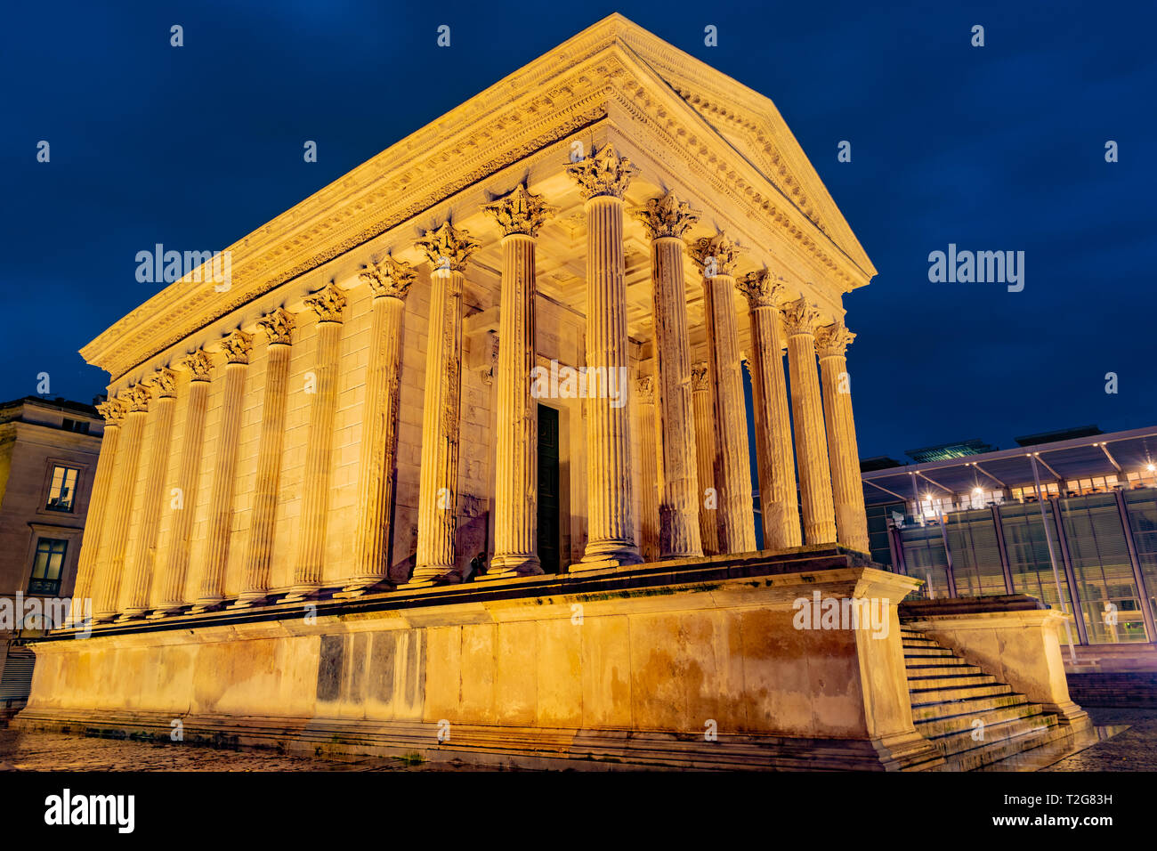 Maison Carree ancient Roman temple in night lights Nimes France