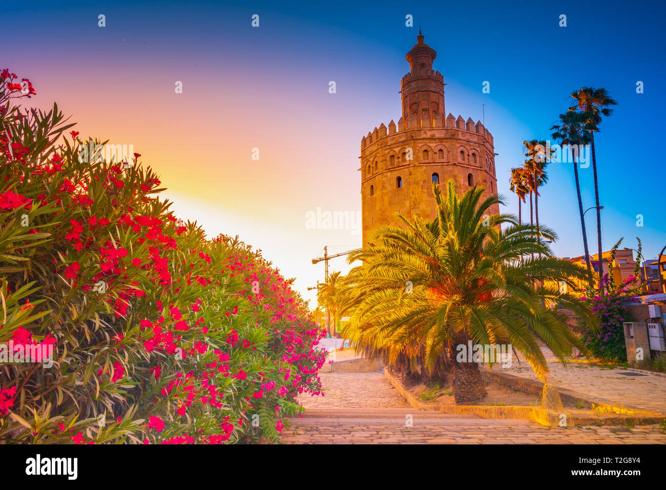 Torre del Oro, meaning Golden Tower, in Seville, Spain is an Albarrana Tower located on the left bank of the Guadalquivir River Stock Photo