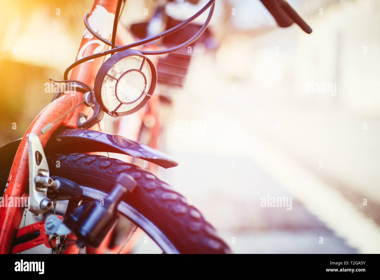 Front picture of a city bike, head lamp and blurry background Stock Photo -  Alamy