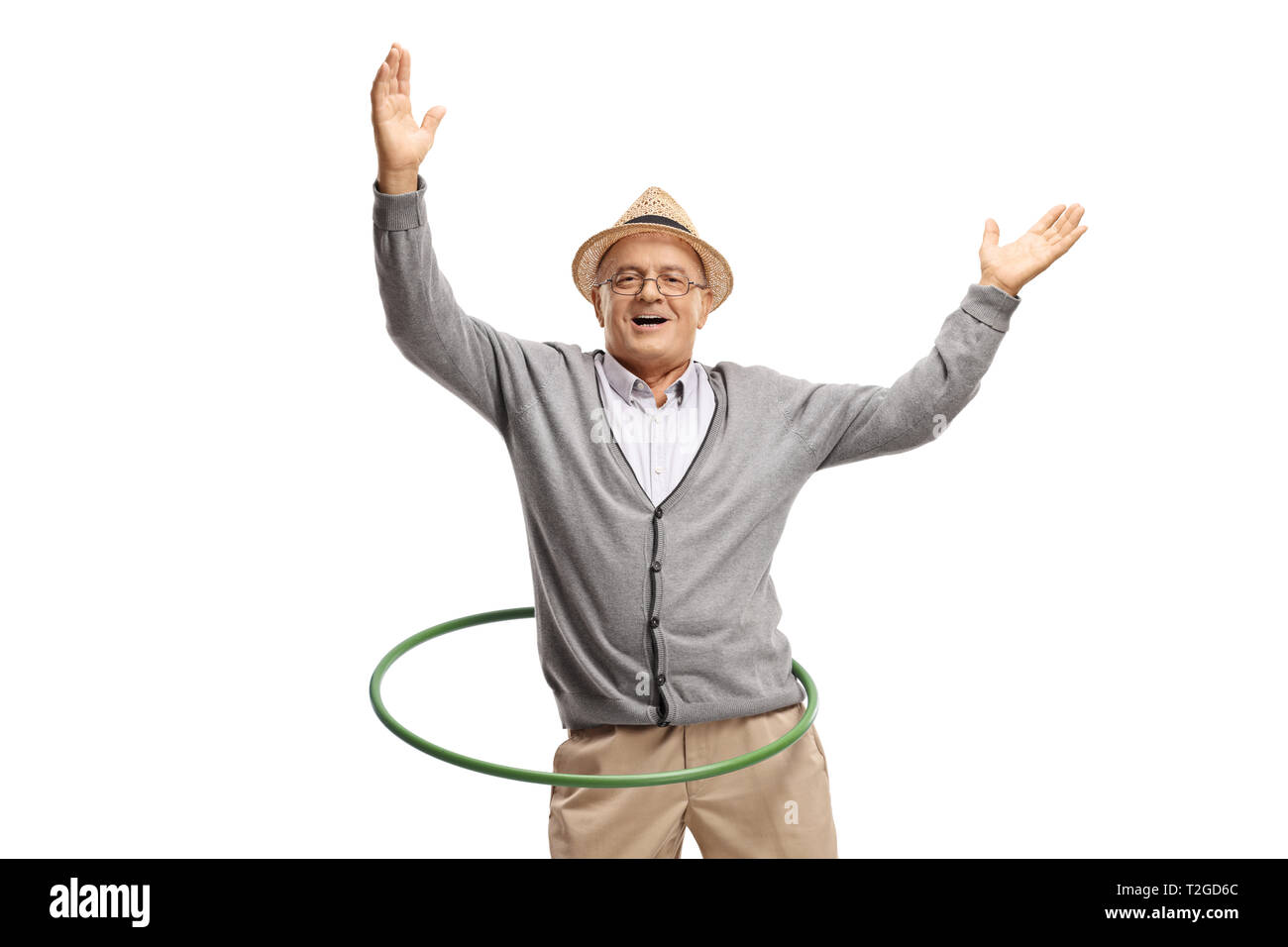 Happy mature man with a hula hoop isolated on white background Stock Photo