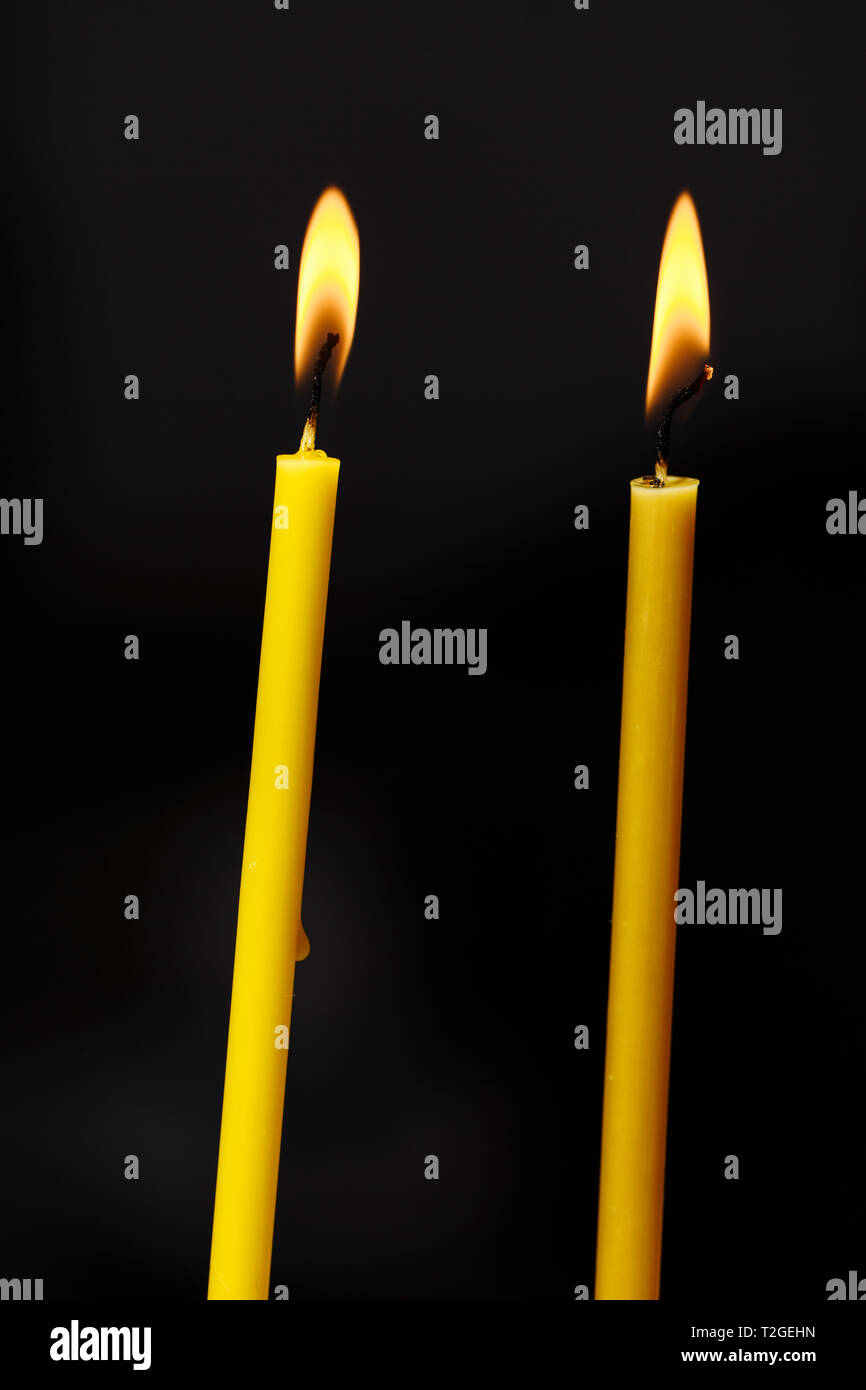 Burning candle on black background Stock Photo Alamy