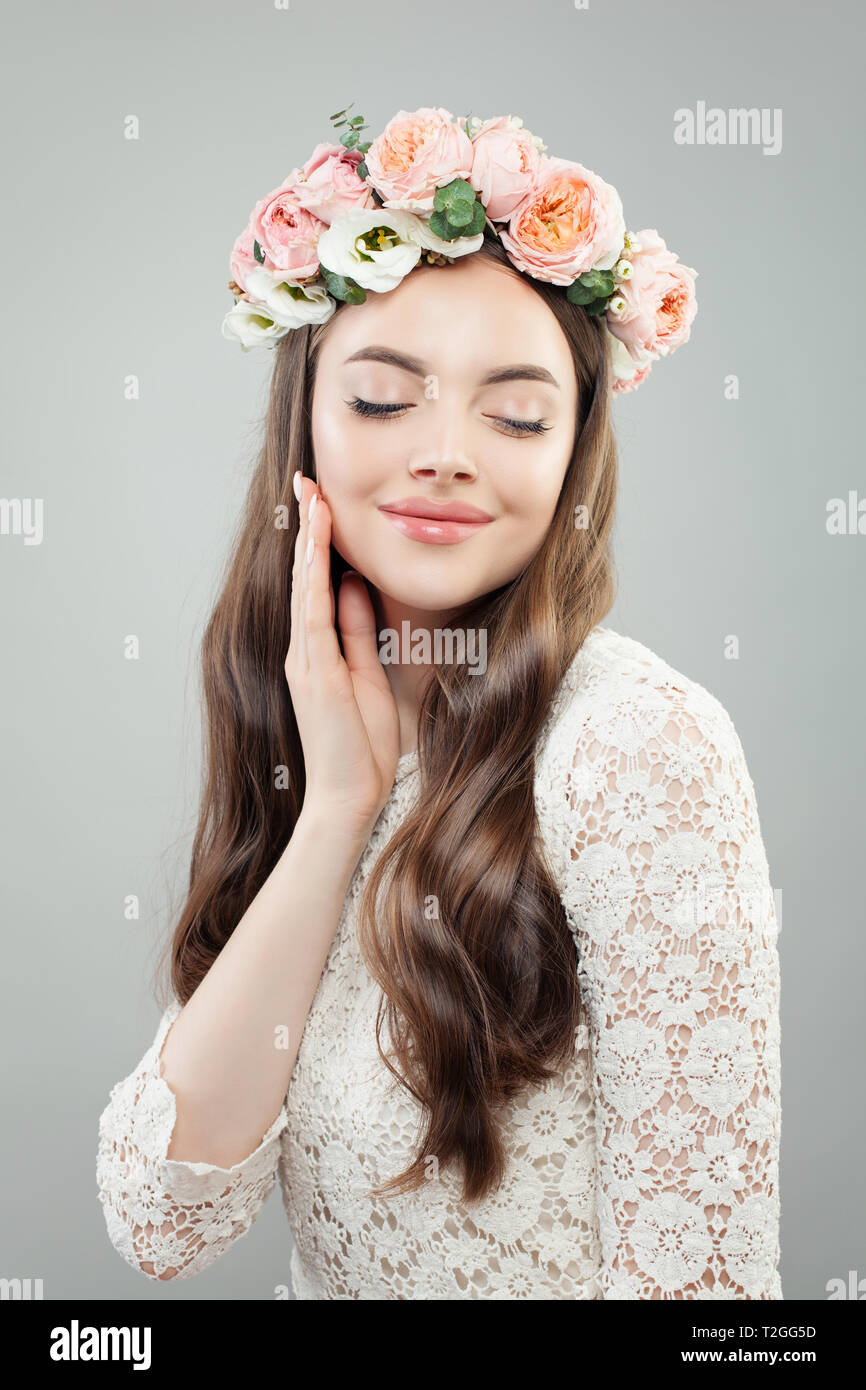 Perfect Woman Model With Curly Hair Makeup And Flowers Relaxing