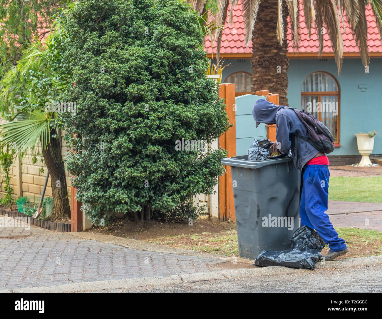 Johannesburg, South Africa unidentified unemployed homeless man picks