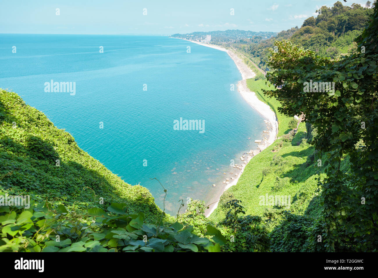 Beautiful view of the Black sea from Botanical garden in Batumi, Georgia. Bright landscape with green-blue water and a lot of greenery on the hills Stock Photo