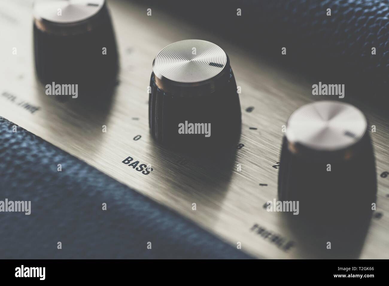 Bass control knob on music amplifier equalizer Stock Photo Alamy