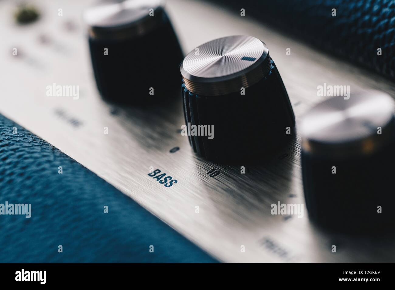 Bass control knob on music amplifier equalizer Stock Photo Alamy