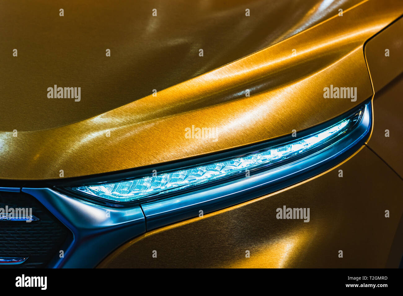 Close up detail shot of headlight of modern luxury sports car. Front view of supercar. Motor sport background concept. Stock Photo