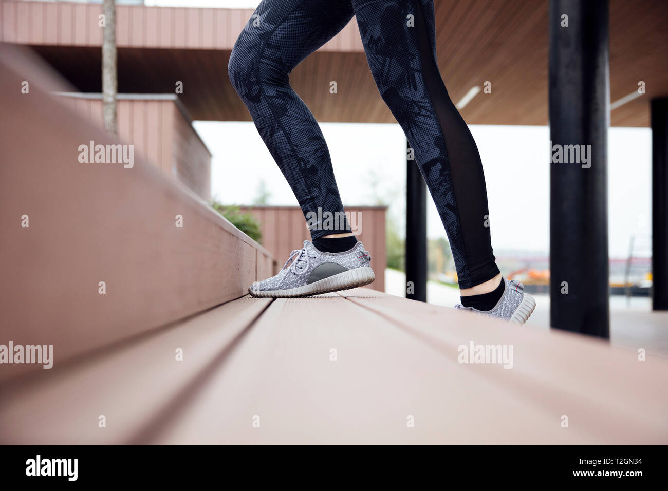 Healthy woman running and climbing up on stairs Stock Photo Alamy