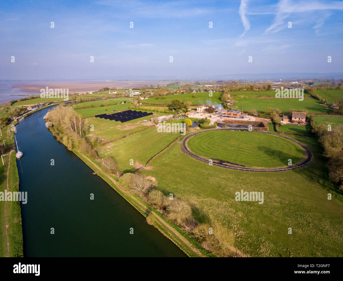 Aerial view of a horse training circle corral outdoors on the grass at