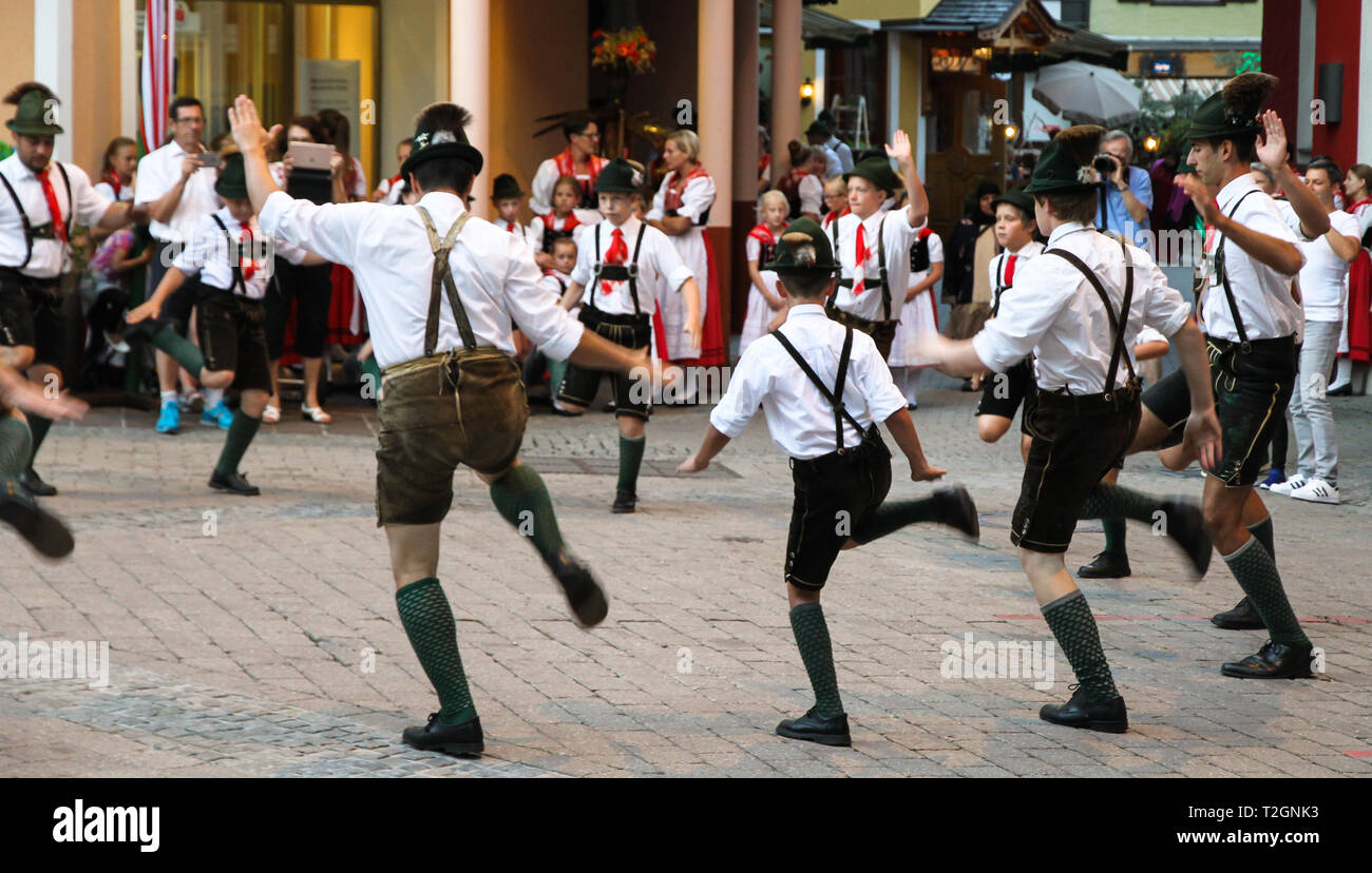 St. Wolfgang im Salzkammergut, Austria - Jul 13, 2017: Traditional Austrian folkloric dancing performing on streets with traditional clothes garments  Stock Photo