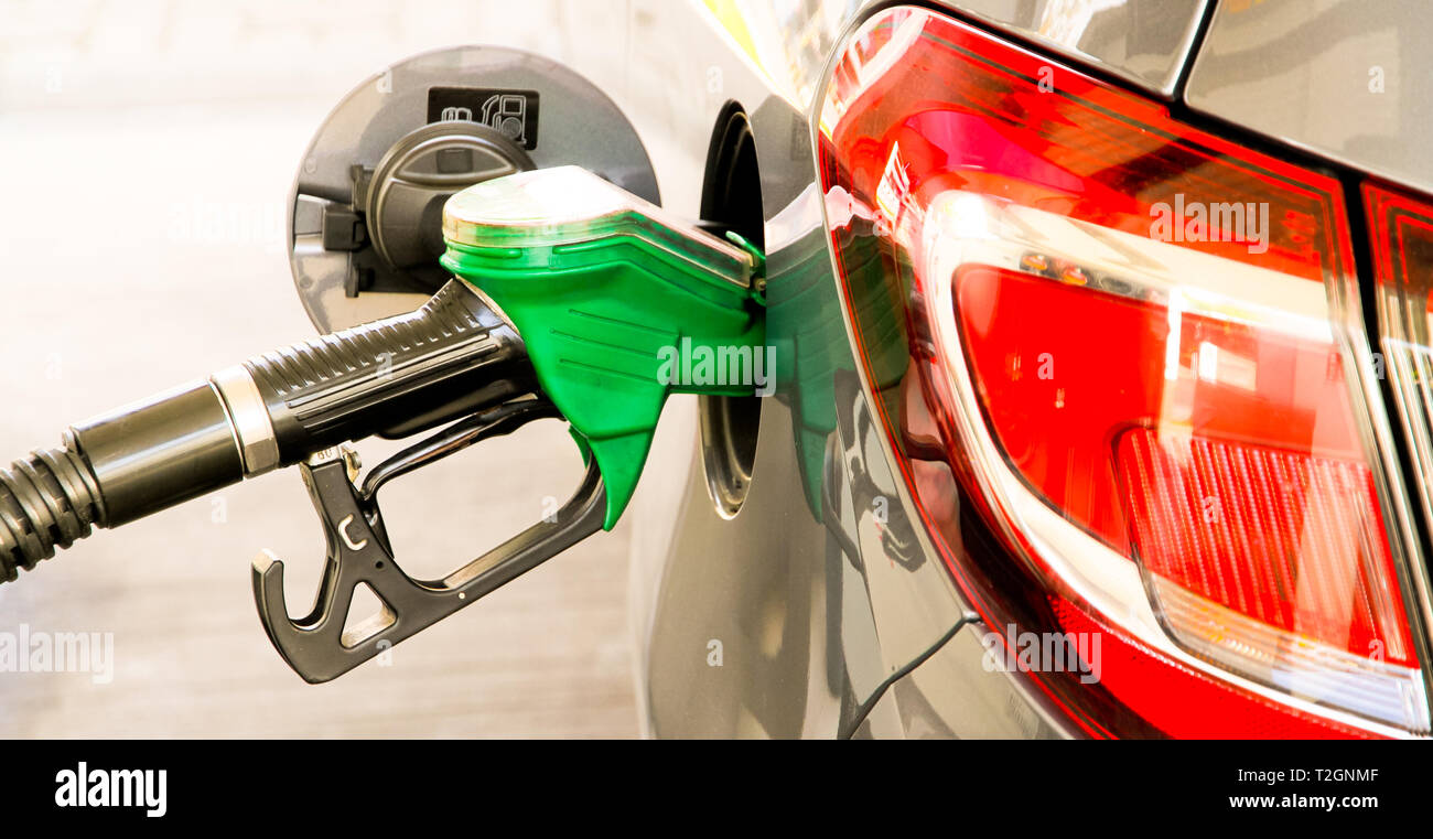 Car refuel at the petrol station. Concept photo for use of fuels (gasoline, diesel, ethanol) in combustion engines, air pollution and environmental an Stock Photo