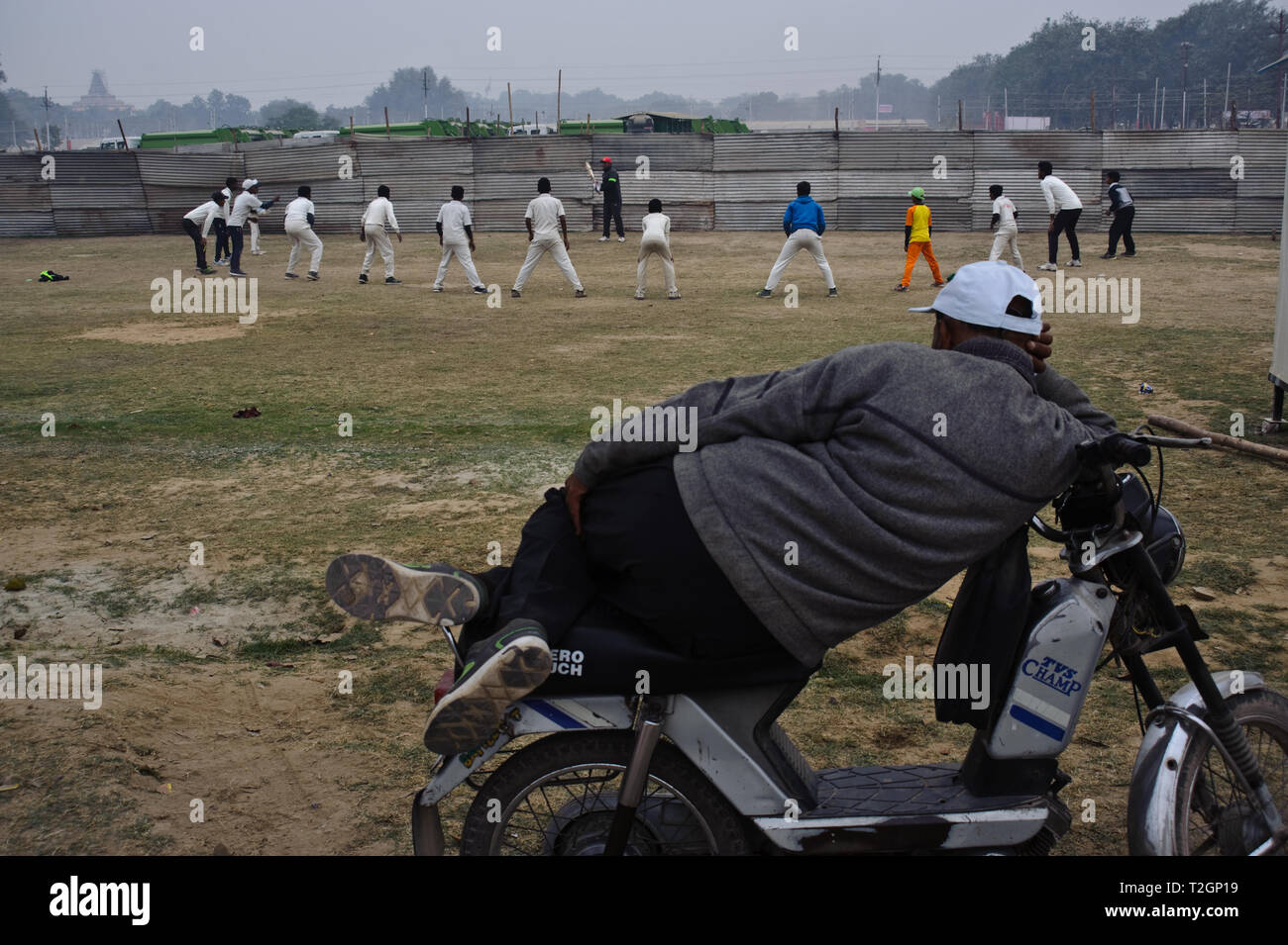 Spectator watching a cricket training ( India) Stock Photo