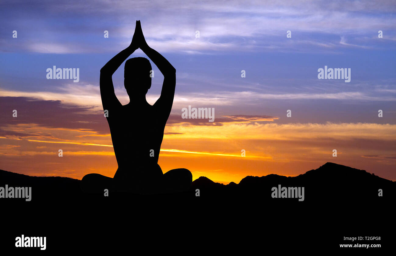 Silhouette of woman meditating at sunset. Yoga retreat concept Stock ...