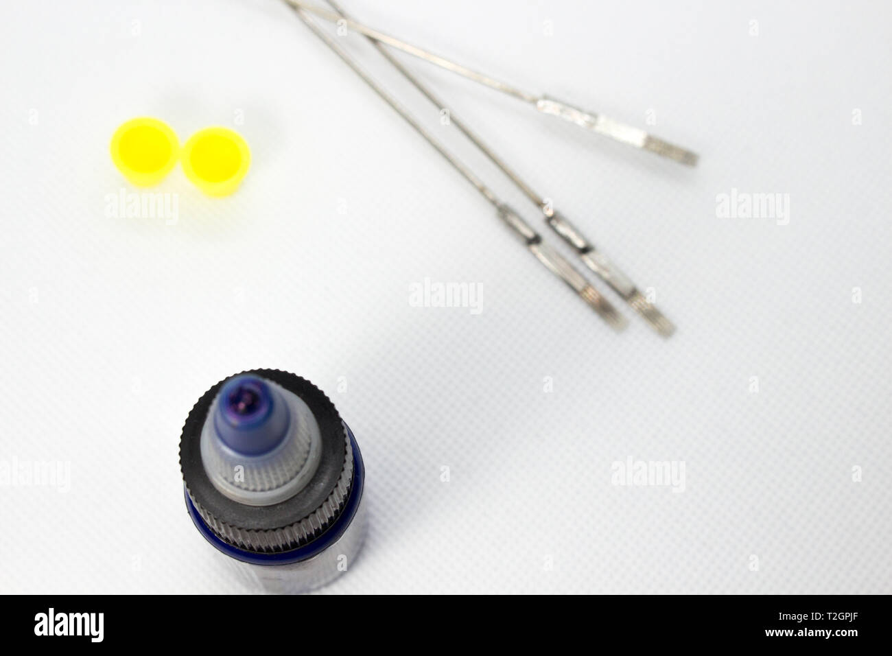 Tattoo equipment, tattoo ink and needle on black background Stock Photo