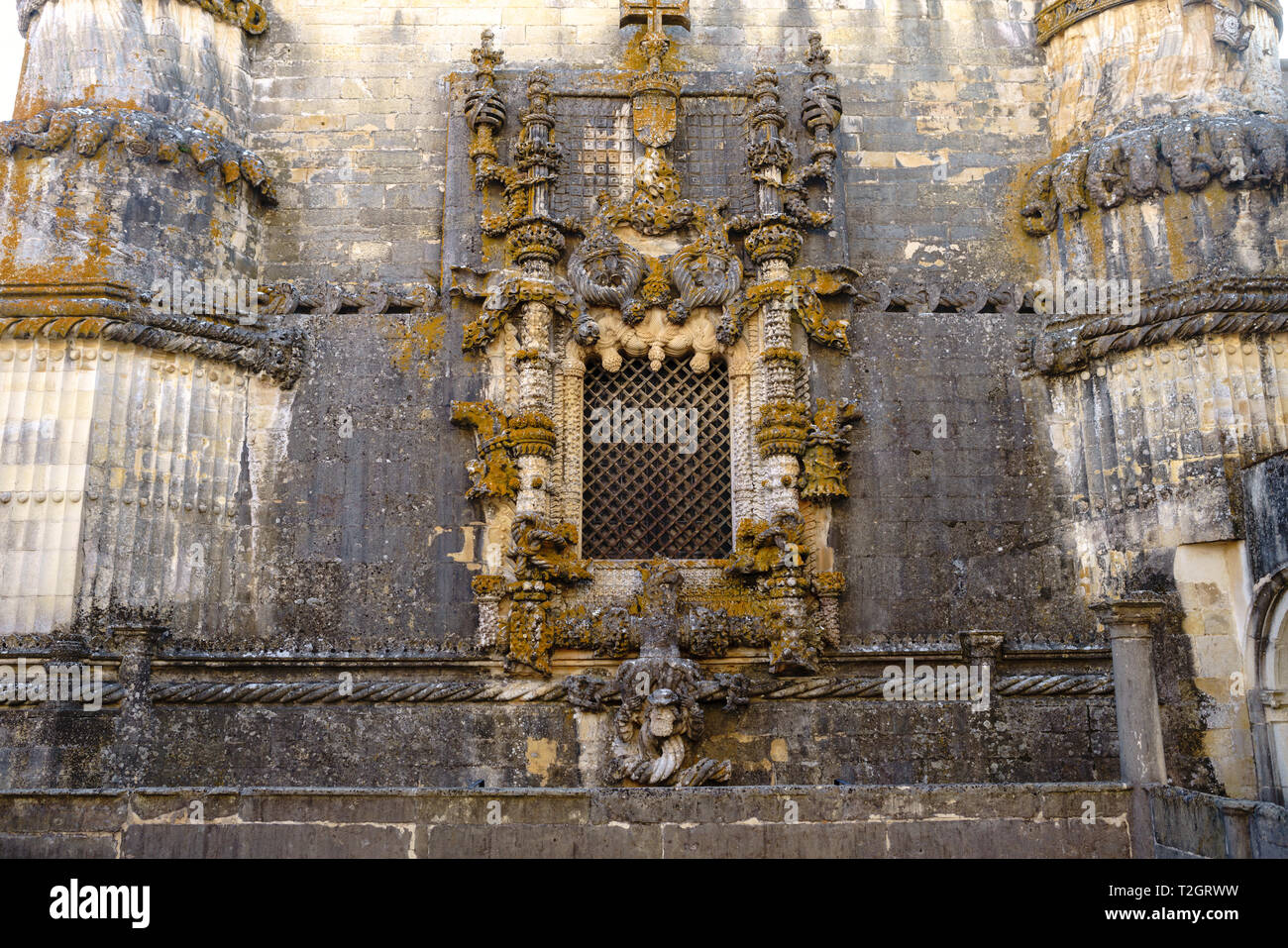 Facade of the Convent of Christ with its famous intricate Manueline window in medieval Templar castle in Tomar in a beautiful summer day, Portugal Stock Photo