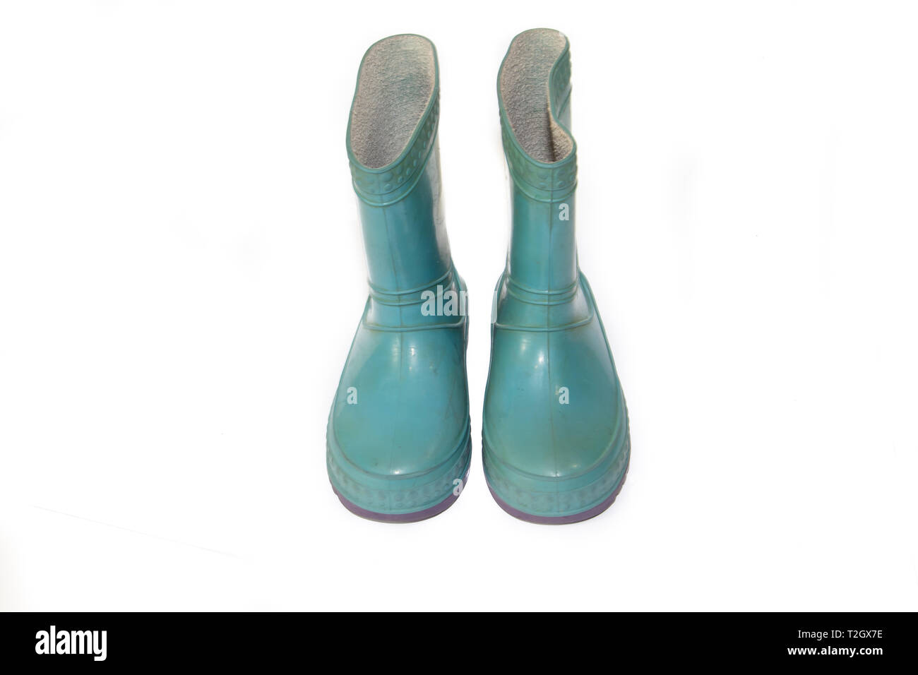 Children's blue rubber boots on a white background. Dry feet in the rain. Children's footwear. Rubber Shoes . Rubber boots. Insulated shoes Stock Photo