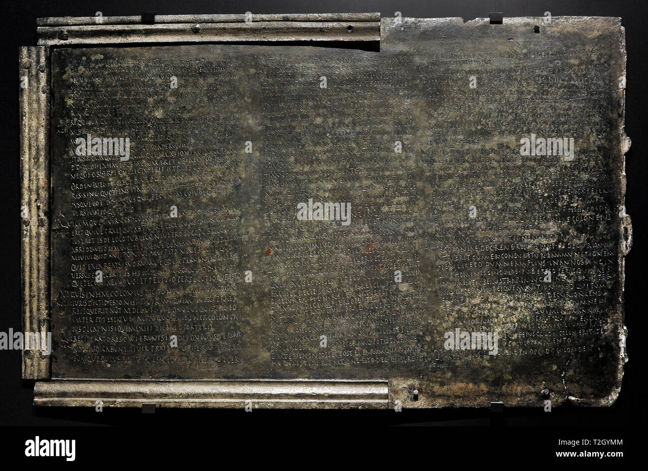 Lex Coloniae Genitiuae Iuliae. Municipal Law of the ancient Urso (Osuna, Seville province, Andalusia, Spain) promulgated in 44 BC. Published in bronze tablets between 20 and 24 AD. Third tablet. Chapters 91 to 99. It deals with the personal benefits of public positions and the inconvenience of receiving gifts. It regulates the rights of association and assembly, the defense of the colony, the qualifications of magistracy candidates and the consensus for making government decisions. National Archaeological Museum. Madrid. Spain. Stock Photo