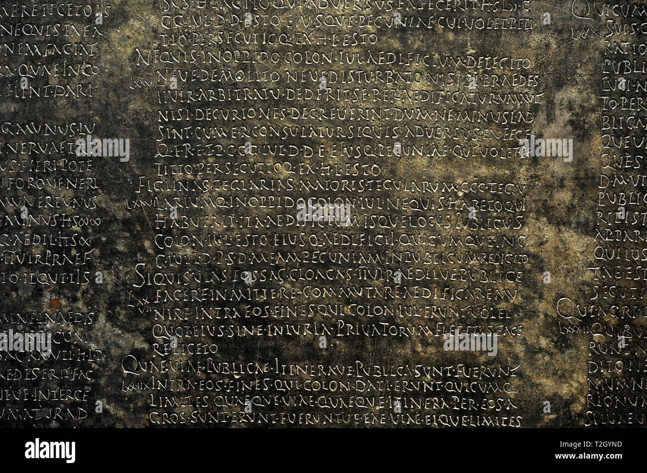 Lex Coloniae Genitiuae Iuliae. Detail. Municipal Law of the ancient Urso (Osuna, province of Seville, Andalusia, Spain) promulgated in 44 BC. Published in bronze tablets between 20 and 24 AD. Second tablet. Chapters 70 to 82. Explains the obligation of augurs and pontifices to reside in the colony, appointment of legates, prohibition of gifts to avoid abuses, jurisdiction of aediles, procedure of popular initiatives and judicial means for colonist to demand the fulfillment of civic obligations. National Archaeological Museum Madrid. Spain. Stock Photo