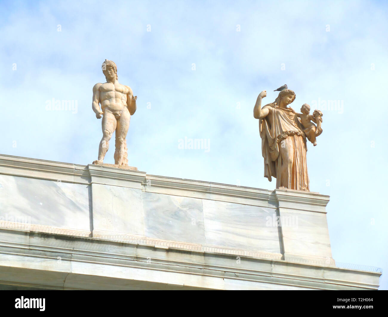 Greek God and Goddess Sculptures on the Rooftop of Historic Building in