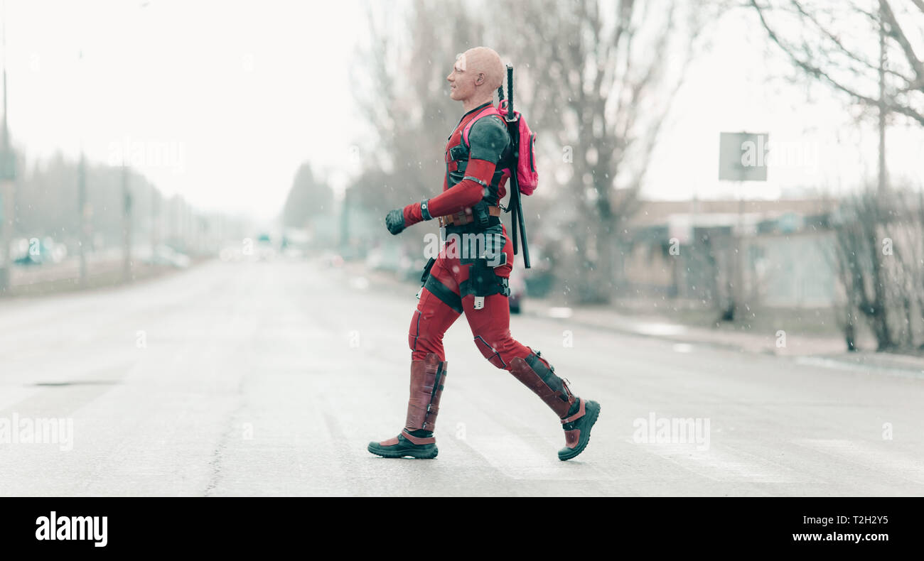 DNIPRO, UKRAINE - MARCH 28, 2019: Deadpool cosplayer crossing the