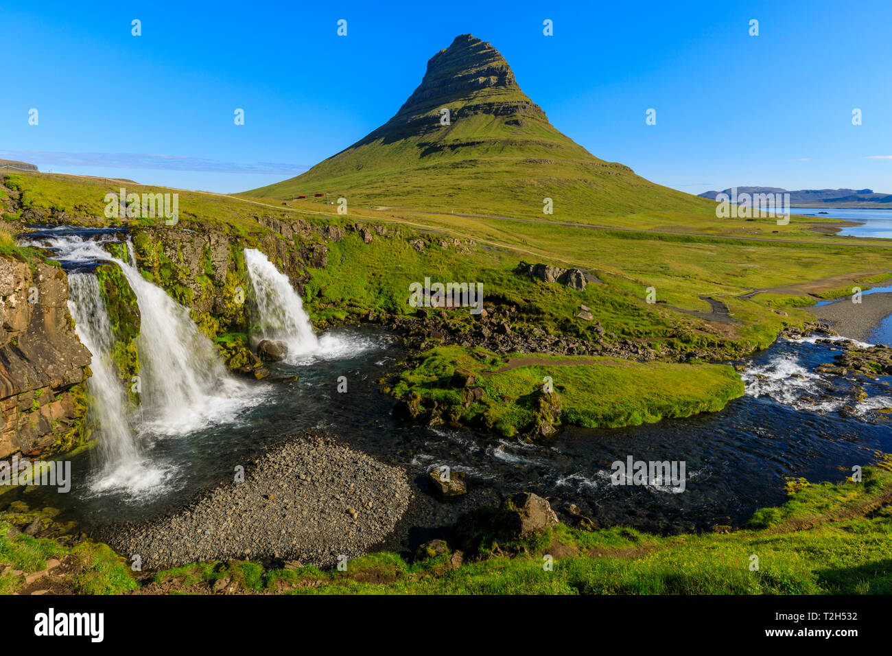 Kirkjufellsfoss waterfall and Kirkjufell mountain in Grundarfjordur, Iceland, Europe Stock Photo