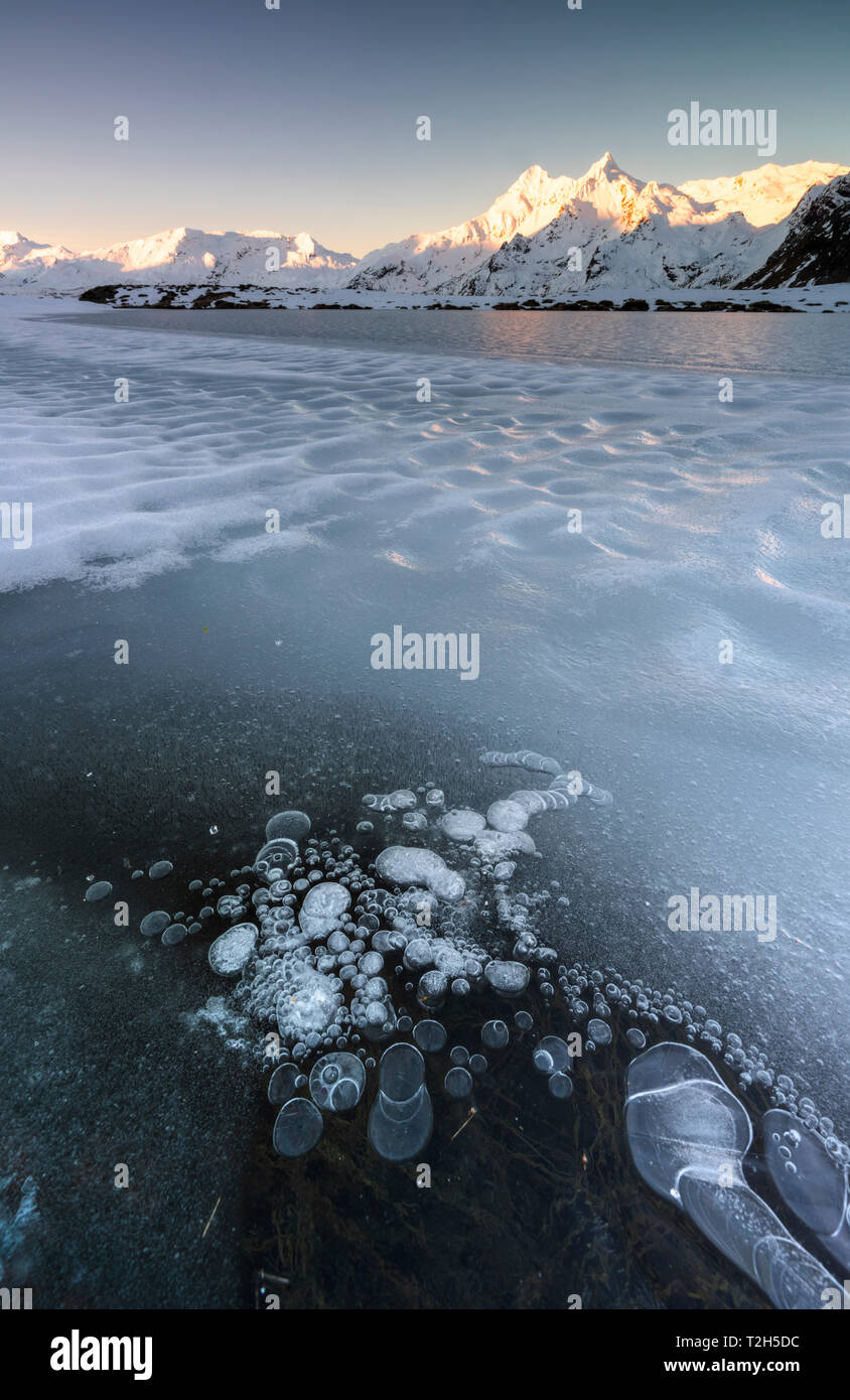 Frozen Lake Andossi in Spluga Valley, Italy, Europe Stock Photo