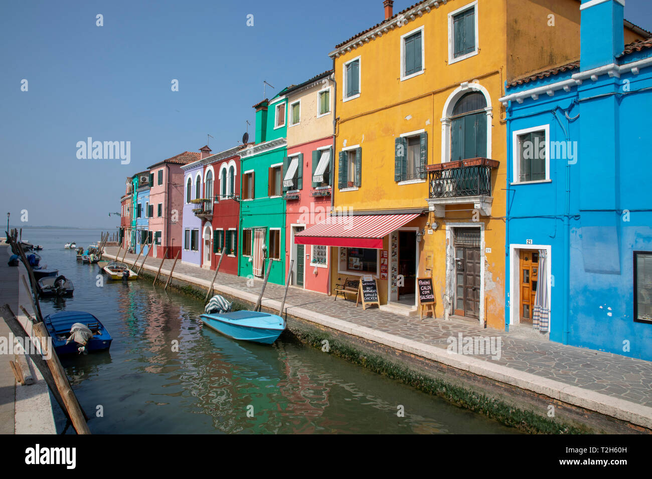 Colorful buildings on canal in Burano, Italy, Europe Stock Photo