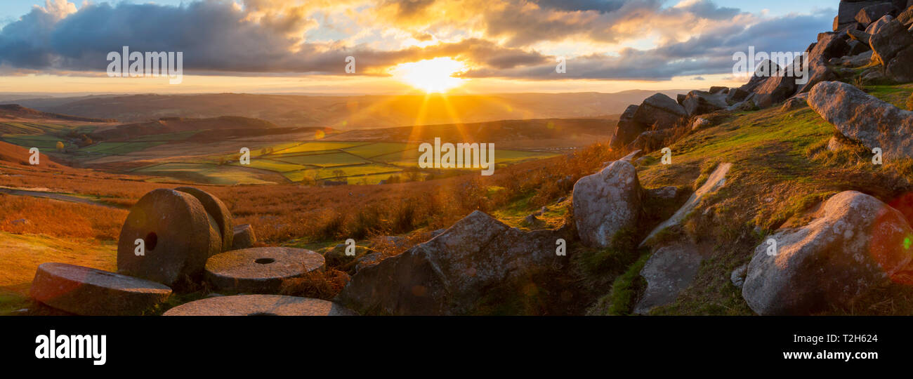 Millstones at Curbar Edge during sunset in Peak District National Park, England, Europe Stock Photo
