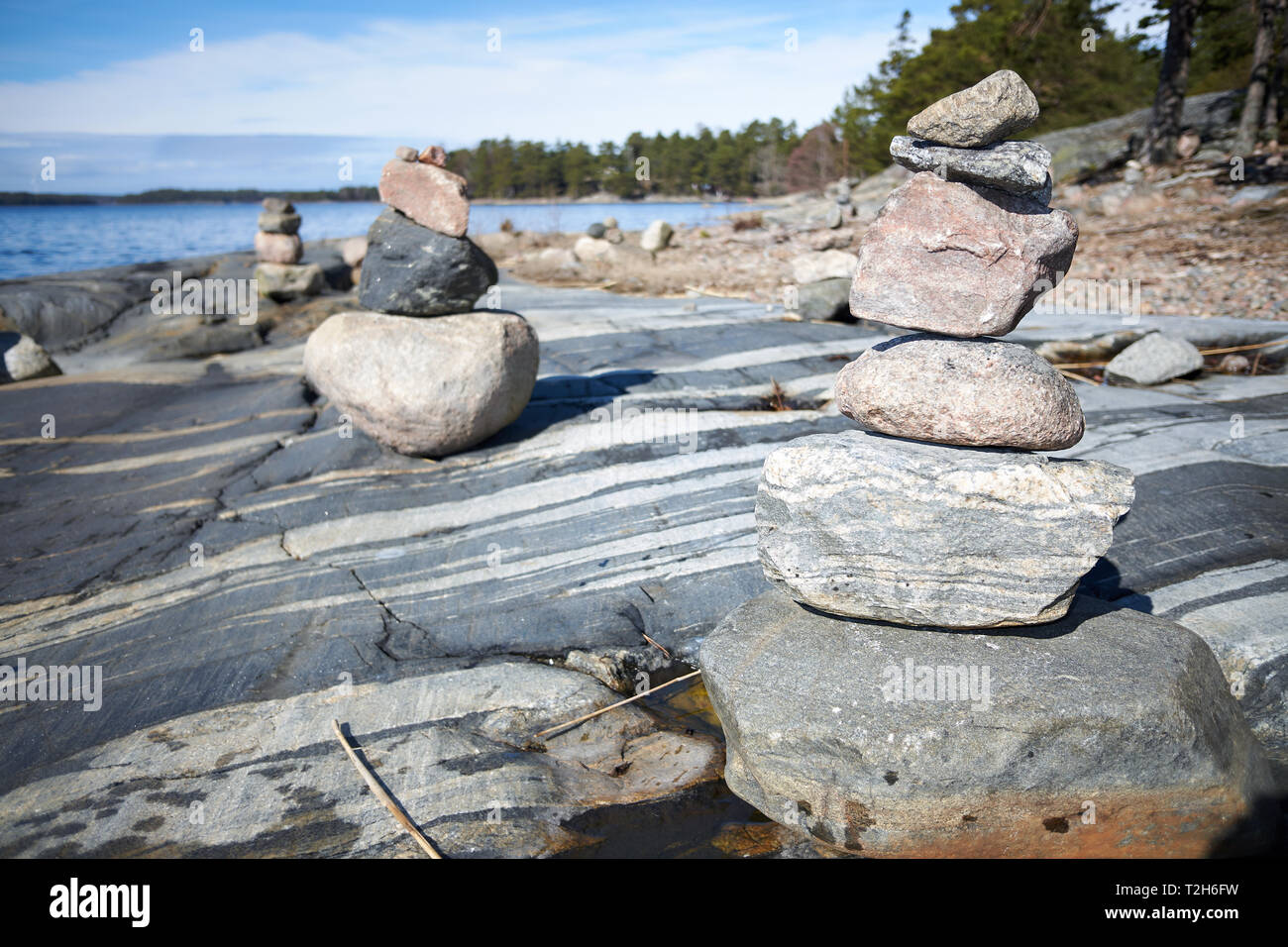 Peaceful summer landscape by the Baltic Sea in Kasnäs, Kemiö, Finland. Wide angle shot of the stack of rocks on the seashore in the Finnish archipelag Stock Photo