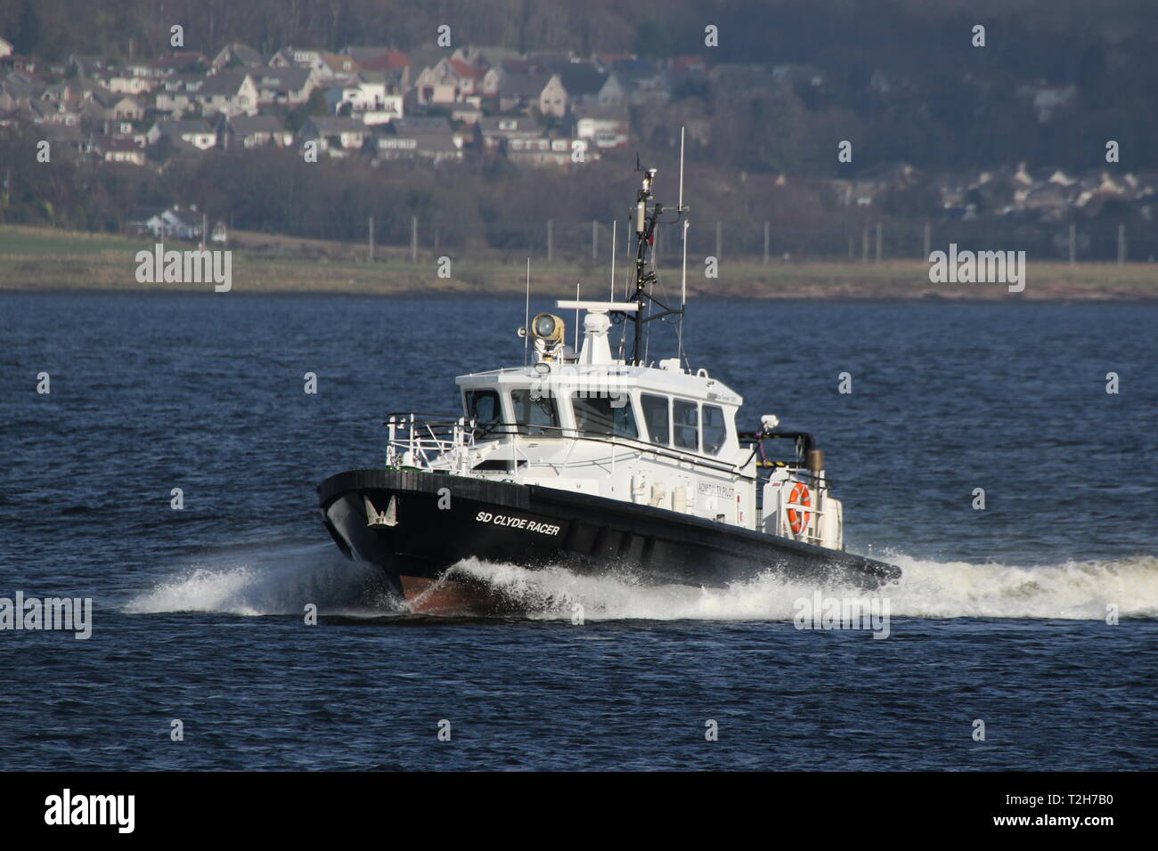 SD Clyde Racer, an Admiralty pilot vessel based on the Firth of Clyde, passing Greenock during the arrival stages of Exercise Joint Warrior 19-1. Stock Photo