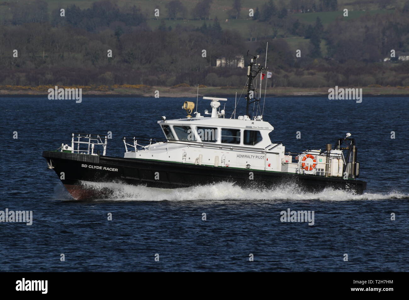 SD Clyde Racer, an Admiralty pilot vessel based on the Firth of Clyde, passing Greenock during the arrival stages of Exercise Joint Warrior 19-1. Stock Photo