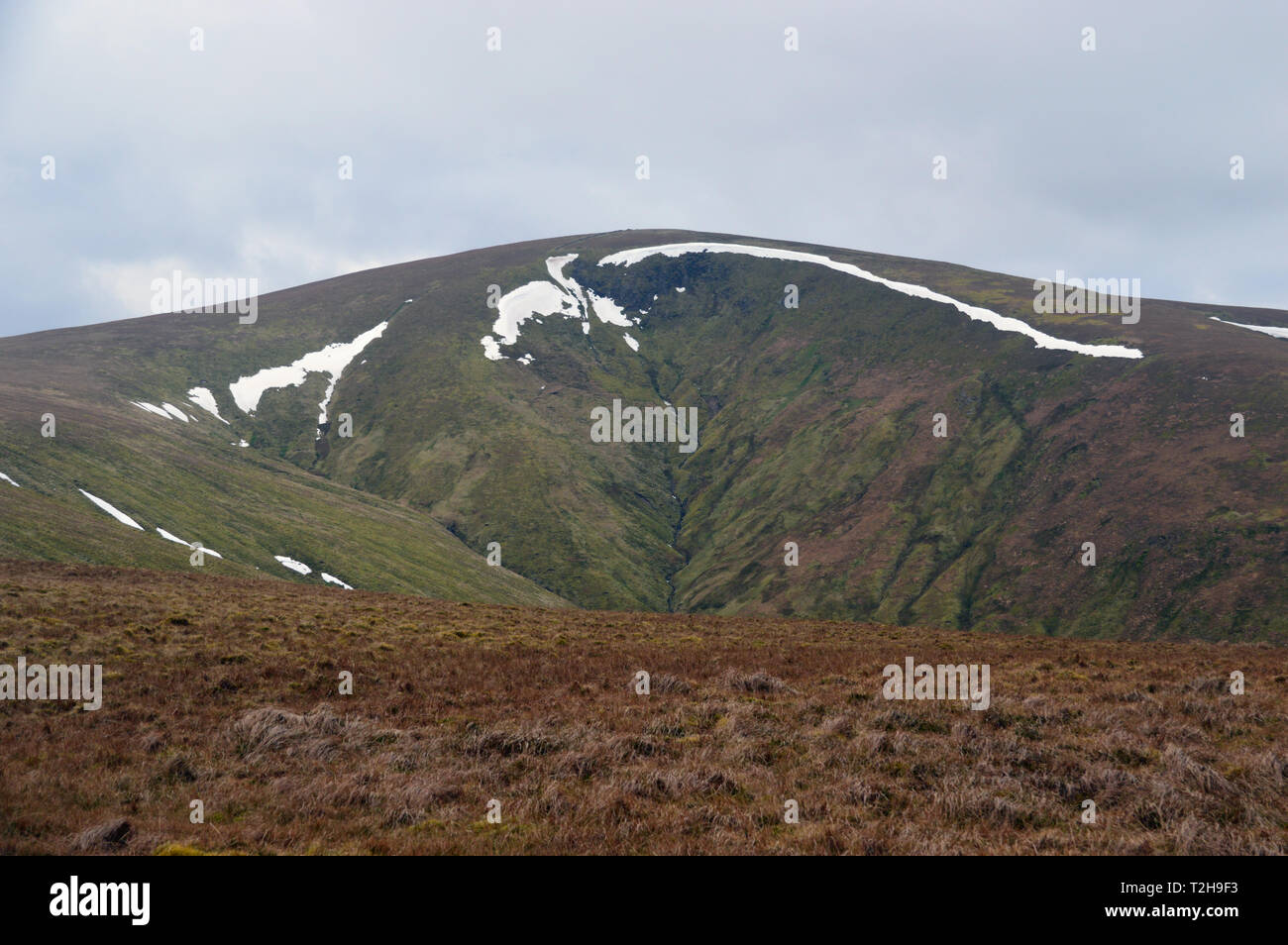 Snow on Deepdale Crag in the Corrie of the Wainwright Stybarrow Dodd from near the Summit of Hart Side Lake District National Park, Cumbria, England. Stock Photo