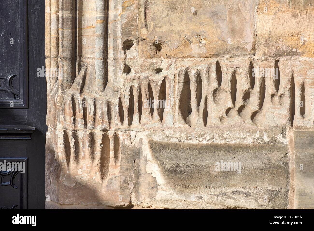 Medieval sharpening grooves on a church wall, the scraped stone dust was considered healing, St. Johanniskirche, Lauf an der Pegnitz, Middle Stock Photo