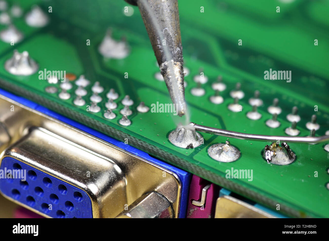 Installation and soldering of electronic components using a soldering iron Stock Photo Alamy