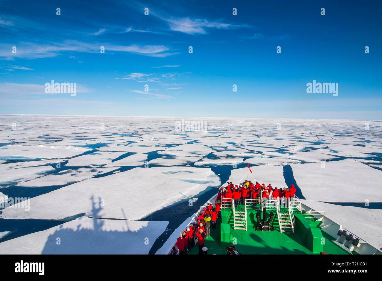 Expedition ship navigating through the pack ice in the Arctic, Svalbard, Norway Stock Photo