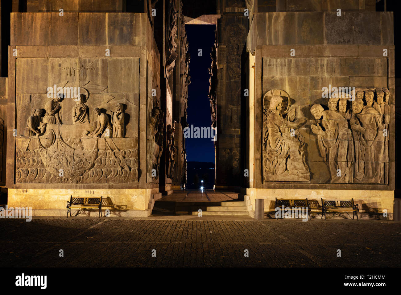 Georgia, Tbilisi - 05.02.2019. - Relief carvings on the walls of massive monumental structure Chronicles of Georgia - Night image Stock Photo