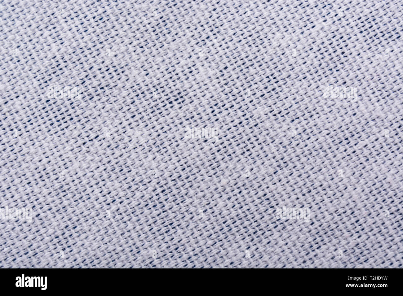 Close-up / macro of cotton material. Stitched line, line of stitches. Stock Photo