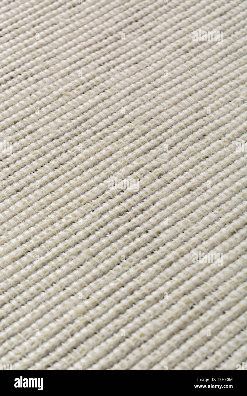 Close-up / macro of material with stitches forming a thread pattern. Stock Photo