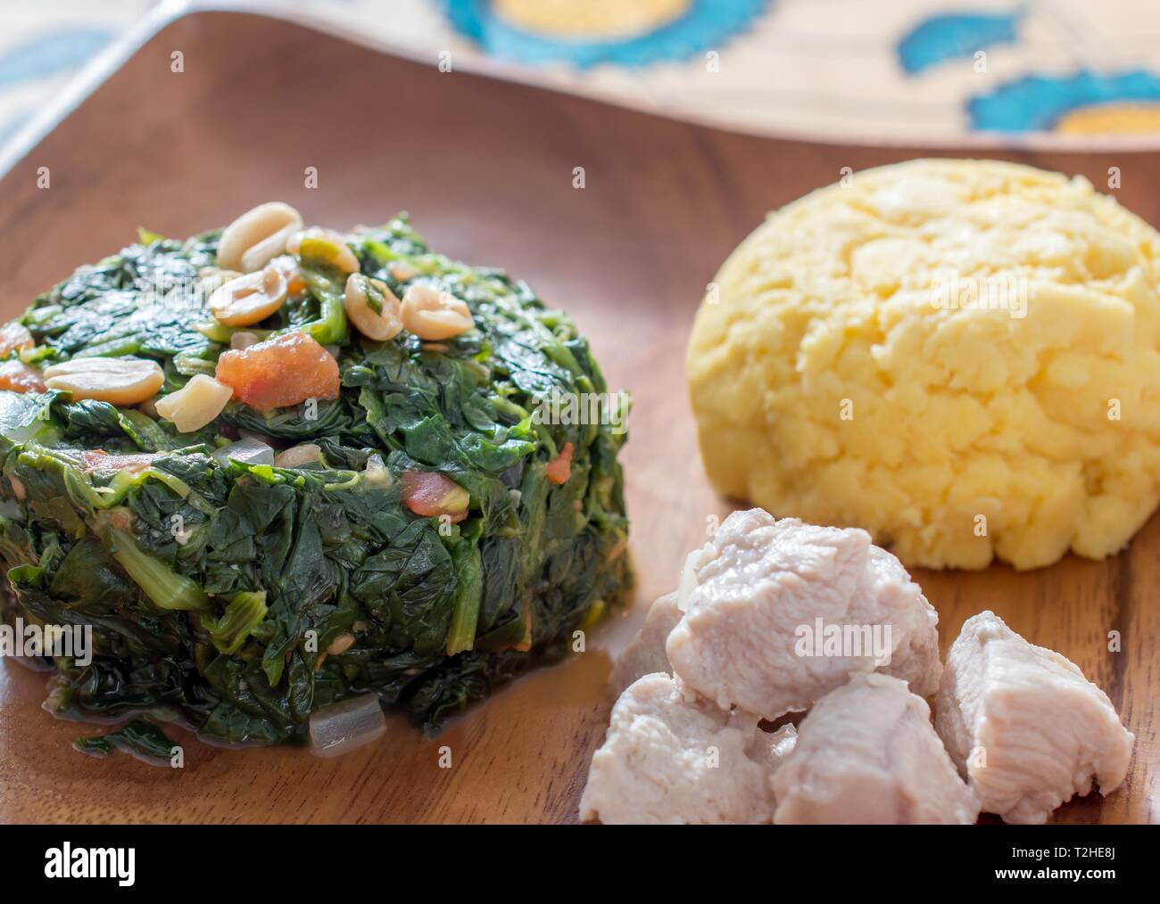 Nchima, polenta with peanut and vegetable sauce, African cuisine, Zambia Stock Photo