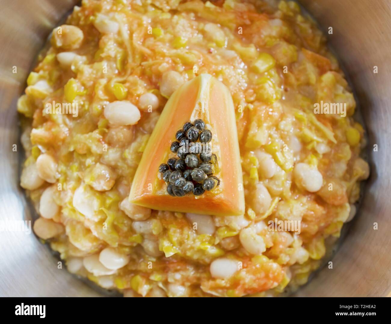 Boiled corn with papaya and chickpeas, dish from Timor Leste, Asian cuisine, East Timor Stock Photo