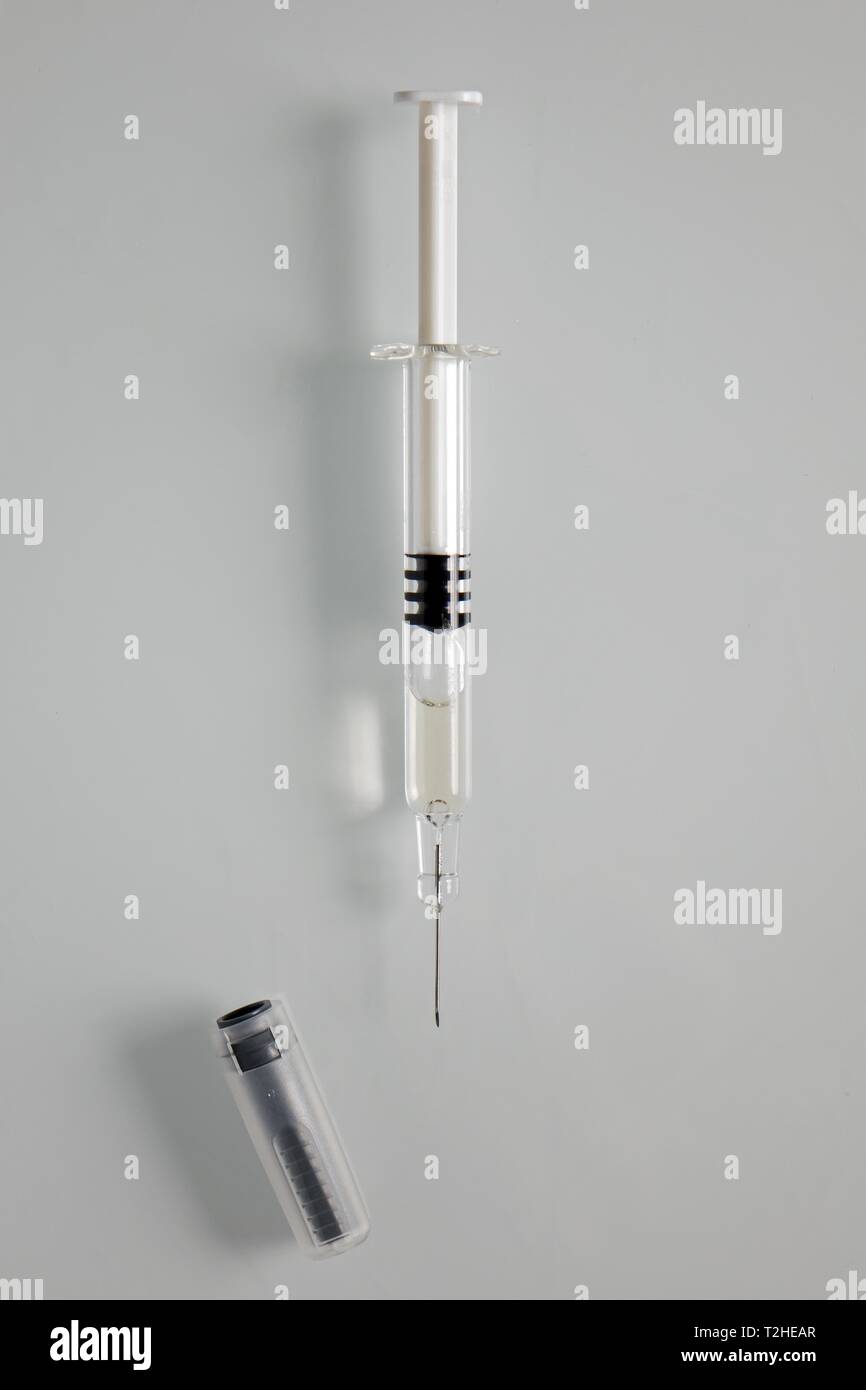 Modern syringe with needle and needle protection, Germany Stock Photo