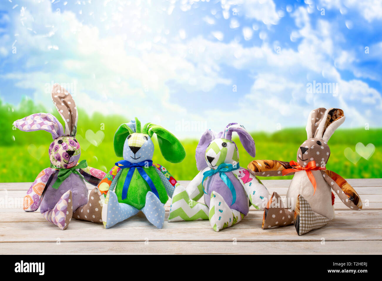 Four Easter bunnies and empty space for text. Easter holiday concept. Stock Photo