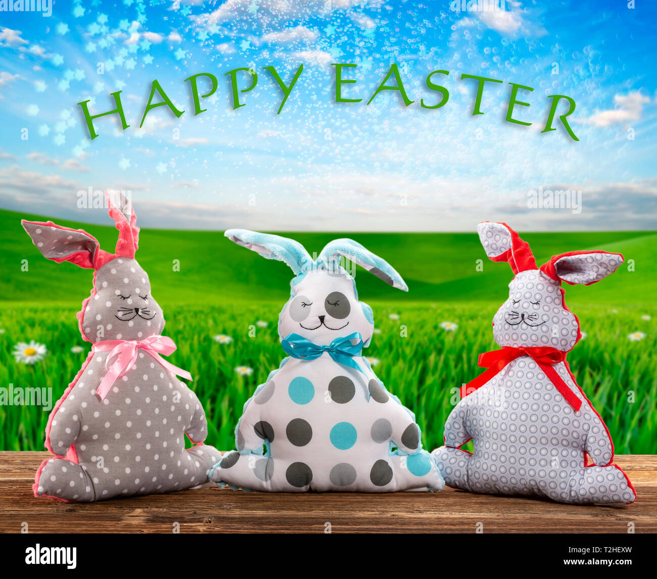 Three Easter bunnies and empty space for text. Easter holiday concept. Stock Photo