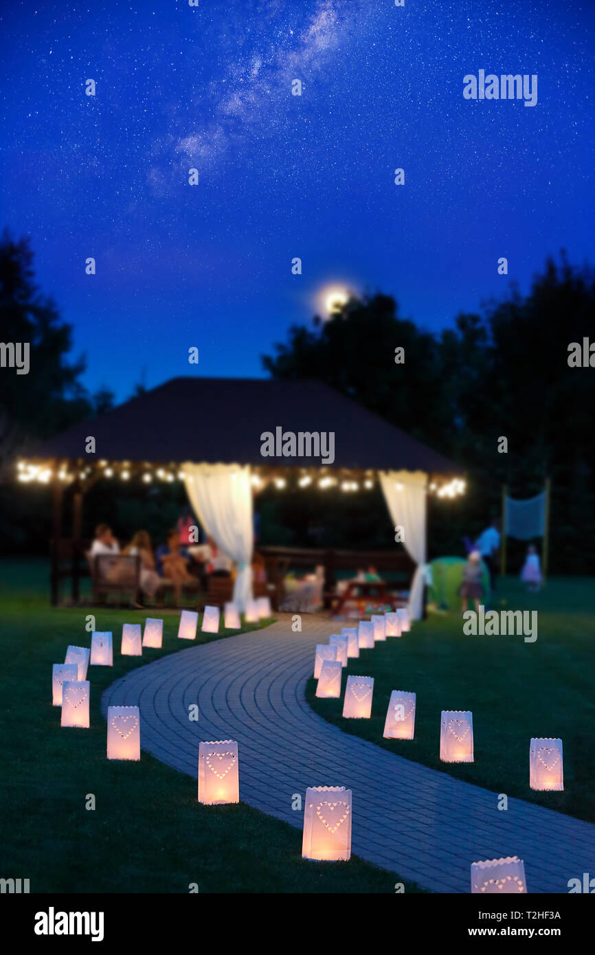 Night Party In The Garden With Empty Path Lit By Lanterns In The