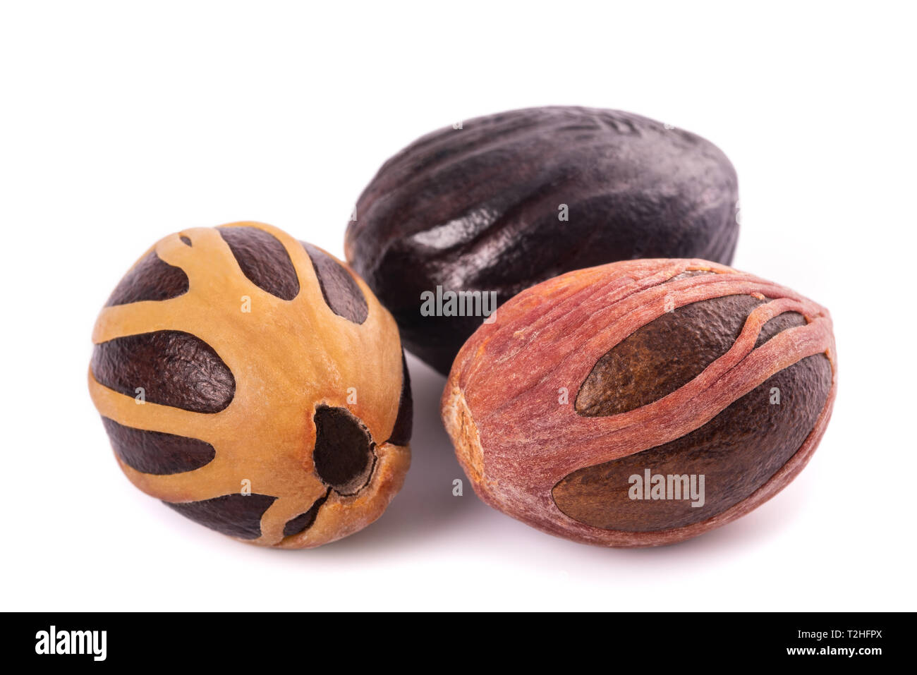 Nutmegs (Myristica fragrans) isolated on white background Stock Photo
