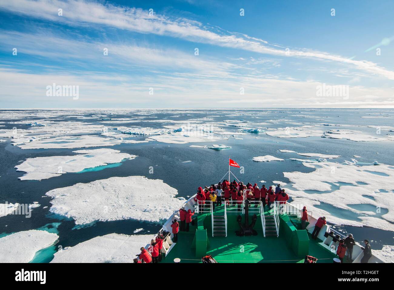 Expedition ship navigating through the pack ice in the Arctic, Svalbard, Norway Stock Photo